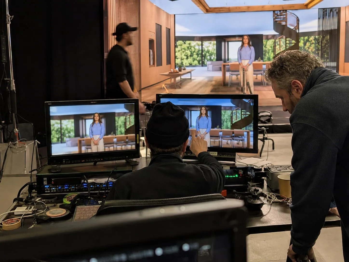 Virtual production team controlling and monitoring a shoot live
