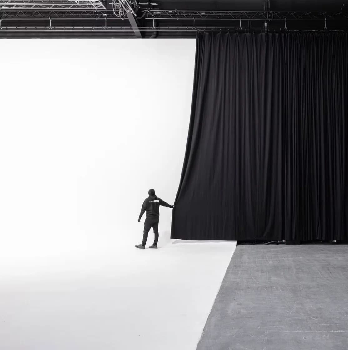 Blackout drapes drawn across the infinity cove for a dark-stage setup