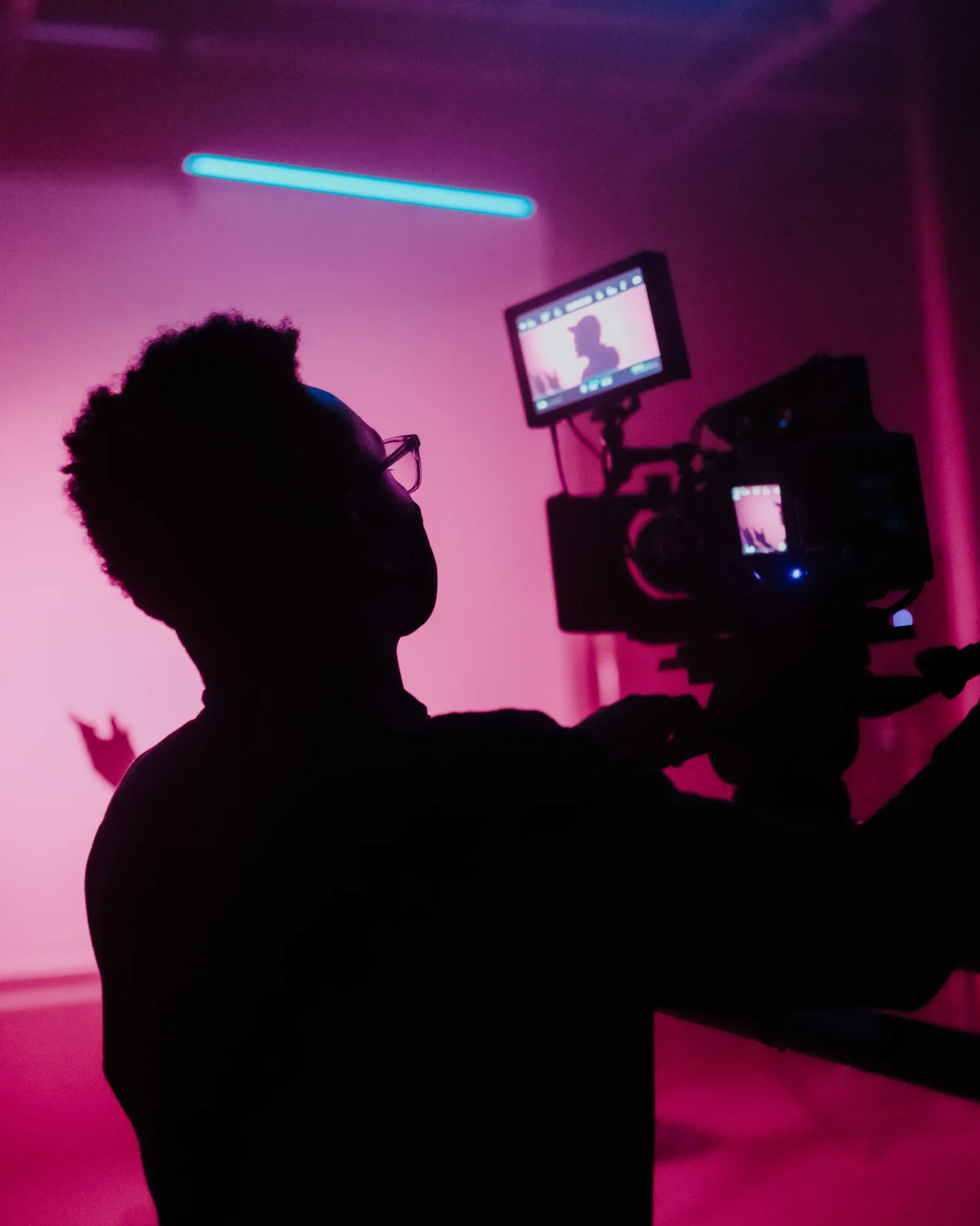 A photo of a film maker being supported by a film studio