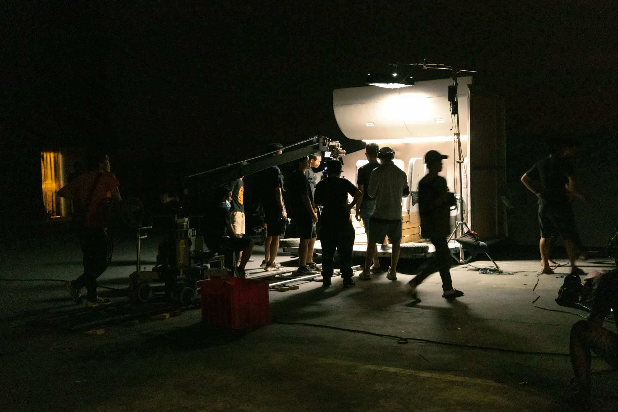 A photo of a film maker being provided equipment in a film studio